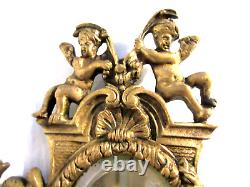 1a2- Miroir ovale biseauté Napoléon III, armature en bronze doré avec 4 angelots