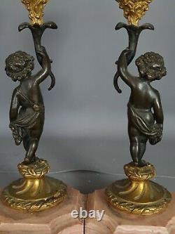 Antique paire de bougeoirs bronze formant des putti XIXe siècle Très bel état