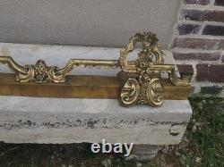 Barre de cheminée XIX EME en bronze. Long 90 cm. Long déployée 116 cm. Haut 21 cm
