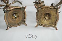 Belle paire de bougeoirs d'autel 19 ème en bronze doré, fleurs, têtes de bélier