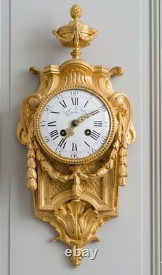 Cartel d'alcôve en bronzes dorés d'aprés un modéle d'Osmond Epoque Napoléon III