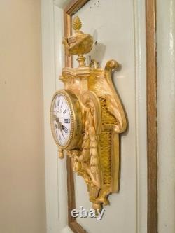 Cartel d'alcôve en bronzes dorés d'aprés un modéle d'Osmond Epoque Napoléon III