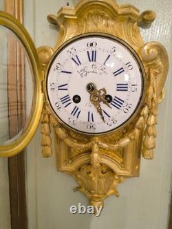 Cartel d'alcôve en bronzes dorés d'aprés un modéle d'Osmond Epoque Napoléon III