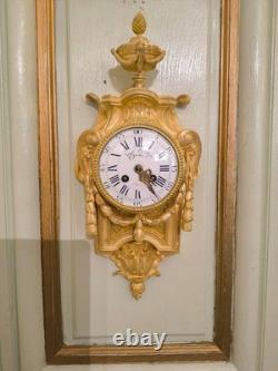 Cartel d'alcôve en bronzes dorés d'aprés un modéle d'Osmond Epoque Napoléon III