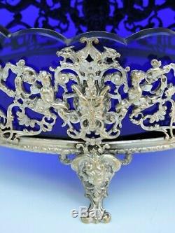 Coupe Napoléon III centre de table verre bleu moulé pied bronze argenté chérubin