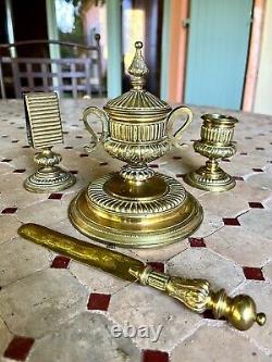 Gilt bronze set-inkwell, candle holder, paper holder, and letter opener. 19th