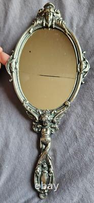 Miroir Face à main Napoléon III en bronze argenté Putto ou ange ailé & mascaron