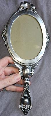 Miroir Face à main Napoléon III en bronze argenté Putto ou ange ailé & mascaron