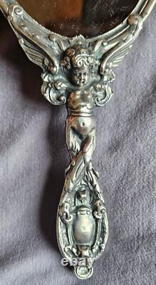 Miroir Face à main Napoléon III en bronze argenté Putto ou ange ailé & mascaron