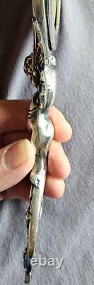 Miroir Face à main Napoléon III en bronze argenté Putto ou ange ailé & mascaron