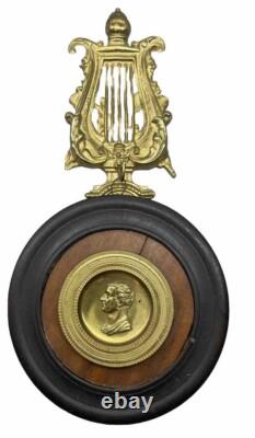 Ornement BRONZE XIX ème Médaillon de NAPOLÉON suspendu à une LYRE