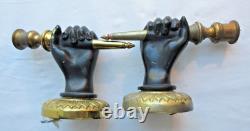 Paire d'appliques murales Napoléon III en bronze Mains noires tenant un flambeau