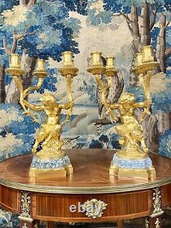 Paire de candelabres Aux Puttis, Bronze Doré. Epoque Napoléon III