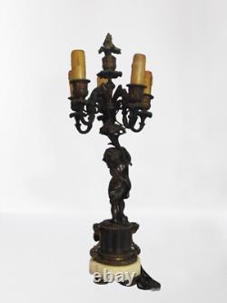 Paire de candelabres Napoleon III aux amours en Bronze doré/bronze patiné