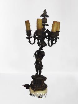 Paire de candelabres Napoleon III aux amours en Bronze doré/bronze patiné