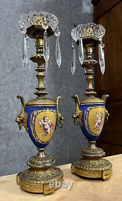 Paire de chandeliers époque Napoléon III en bronze doré et porcelaine de Sévres