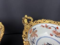 Paire de coupes de style Imari en porcelaine polychrome et bronze doré