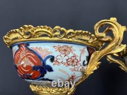 Paire de coupes de style Imari en porcelaine polychrome et bronze doré