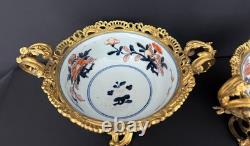 Paire de coupes de style Imari en porcelaine polychrome et bronze doré