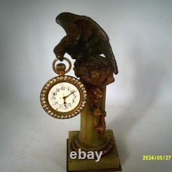 Pendulette ancienne tenu par un aigle en bronze N III