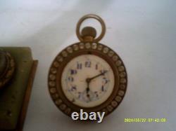 Pendulette ancienne tenu par un aigle en bronze N III
