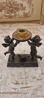 Unique French dark bronze Candle holder With Two cherub puttos holding it
