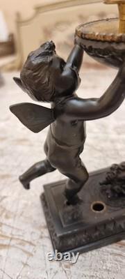 Unique French dark bronze Candle holder With Two cherub puttos holding it
