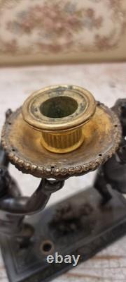 Unique French dark bronze Candle holder With Two cherub puttos holding it