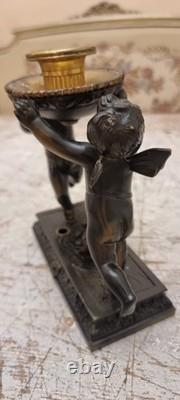 Unique French dark bronze Candle holder With Two cherub puttos holding it